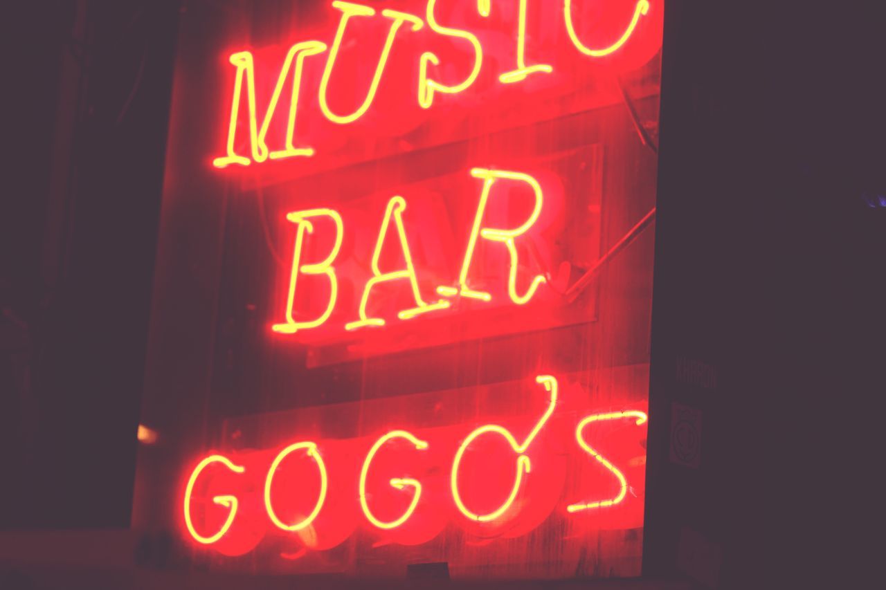 CLOSE-UP OF RED NEON SIGN