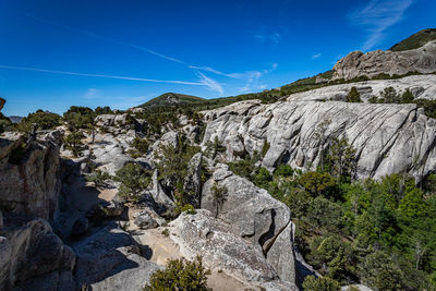 Scenic view of rocky mountains against clear blue sky