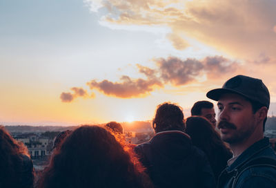 Group of people against sky during sunset