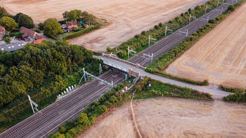 High angle view of road passing over train track 