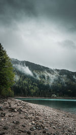 Scenic view of waterfall against sky