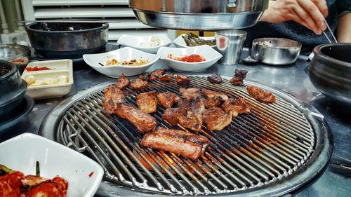 Close-up of meat on barbecue grill