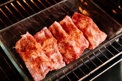 High angle view of meat on barbecue grill