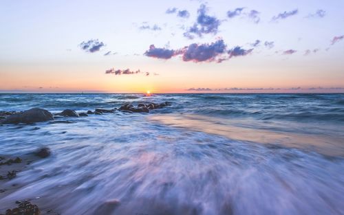 Scenic view of sea at sunset