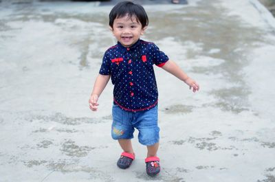 Portrait of boy standing on beach