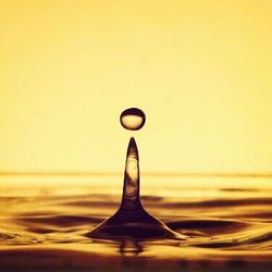 Close-up of water over white background