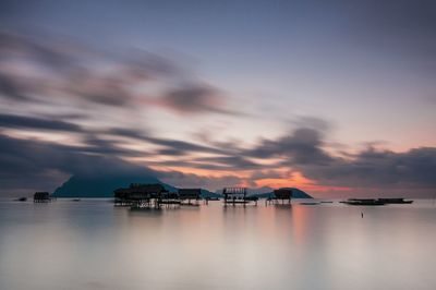 Scenic view of sea against sky at sunset