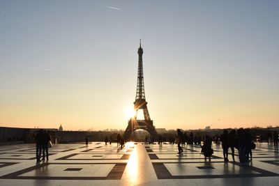 Silhouette eiffel tower against sky during sunset