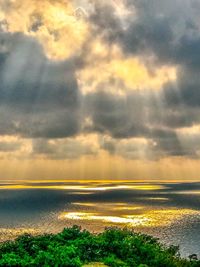 Scenic view of sea against dramatic sky