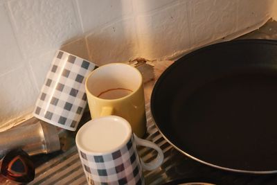 High angle view of coffee cup on table at home