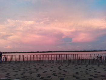 Scenic view of beach against sky during sunset