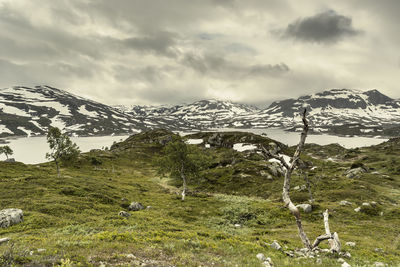 Scenic view of snowcapped mountains against sky