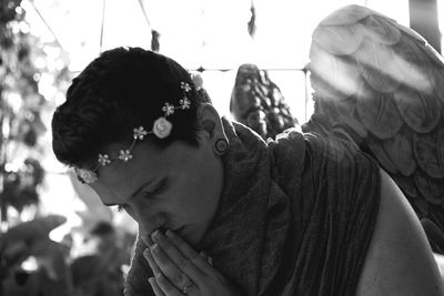 Portrait of young woman looking away outdoors