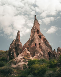 Low angle view of rock formations on landscape against sky