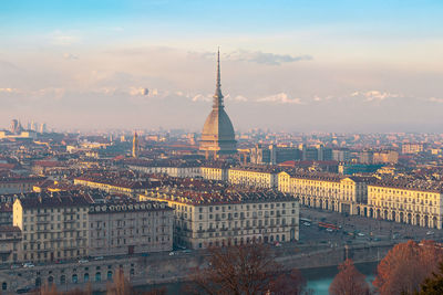 Aerial view of city buildings during sunset