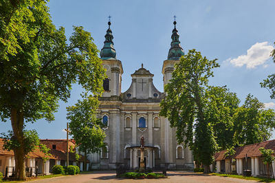 Facade of historic baroque church against sky