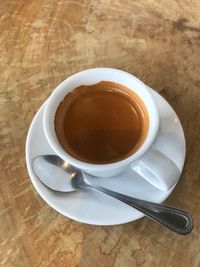 High angle view of coffee cup on table