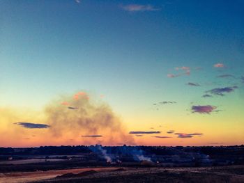 Scenic view of landscape against sky at sunset