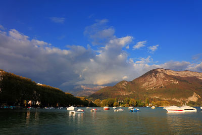 Scenic view of lake and mountains against sky