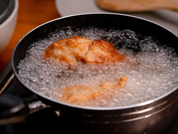 High angle view of meat in cooking pan