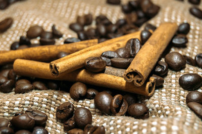 Close-up of roasted coffee beans on table