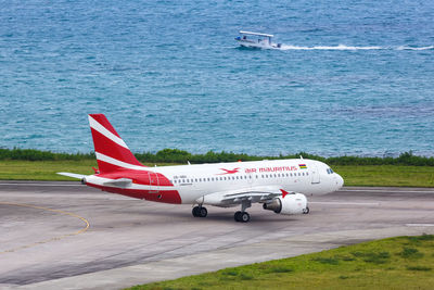 High angle view of airplane on airport runway