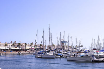 Boats moored at harbor