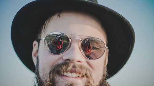 Close-up portrait of man wearing sunglasses