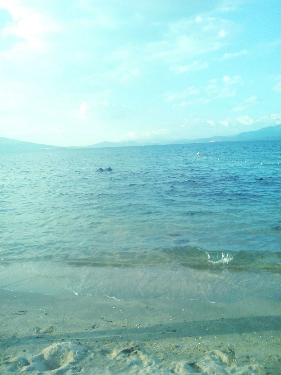 sea, water, horizon over water, sky, blue, beach, tranquil scene, tranquility, scenics, beauty in nature, nature, shore, cloud - sky, idyllic, waterfront, sand, cloud, day, seascape, outdoors