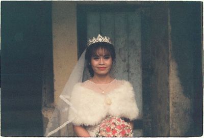 Portrait of beautiful bride holding bouquet