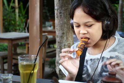 Girl having food and drink at restaurant