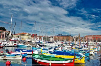 Boats moored at harbor