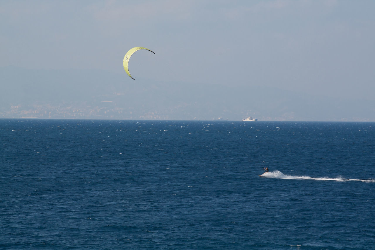 sea, water, flying, horizon over water, waterfront, bird, mid-air, scenics, beauty in nature, tranquility, one animal, tranquil scene, animal themes, nature, sky, wildlife, blue, rippled, animals in the wild, wave