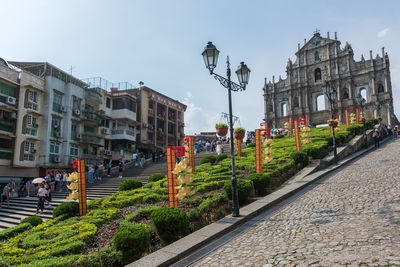 Street amidst buildings against sky