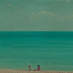 Scenic view of sea against blue sky