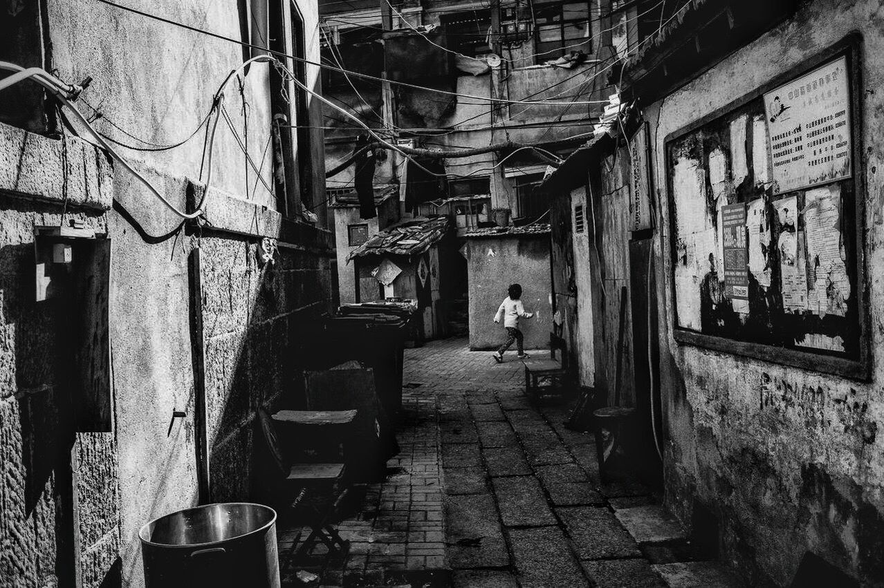 architecture, built structure, people, building exterior, indoors, window, old, lifestyles, abandoned, sitting, building, day, chair, rear view, wall - building feature, leisure activity