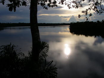 Scenic view of lake against sky at sunset