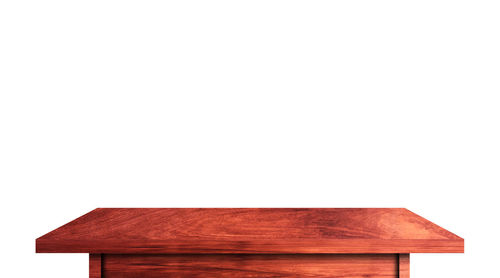 Close-up of red wooden wall against white background