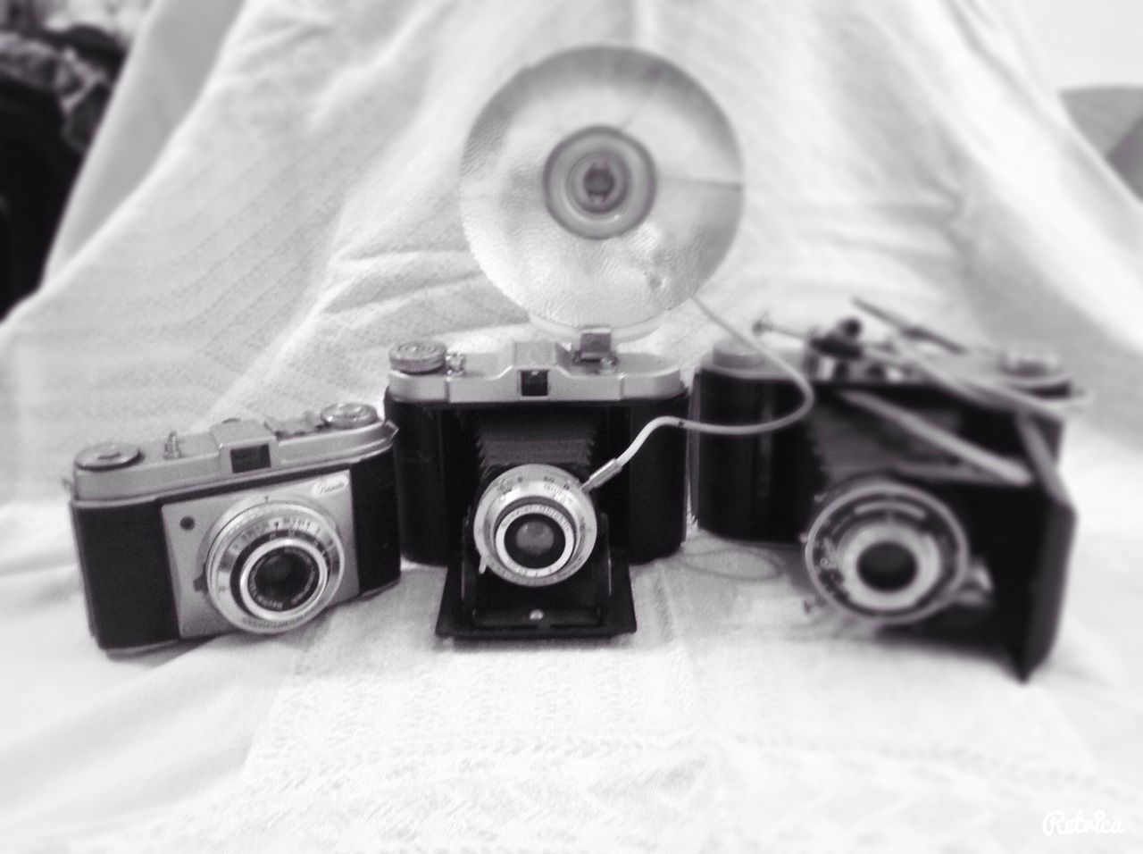 indoors, technology, retro styled, old-fashioned, close-up, still life, photography themes, antique, camera - photographic equipment, equipment, man made object, music, arts culture and entertainment, front view, connection, toy, single object, accuracy, no people, table