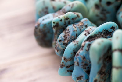 Close-up of stone bracelet on table