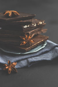 Close-up of chocolate bars with star anise on table