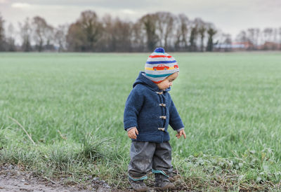 Girl standing at farm