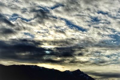Scenic view of mountains against dramatic sky