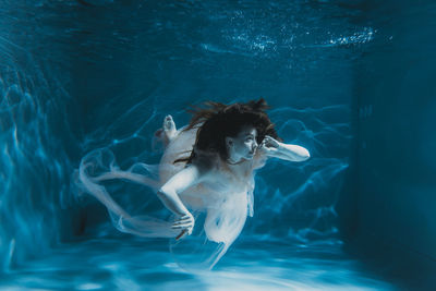 Woman swimming in pool