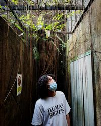 Man looking up in an abandoned room