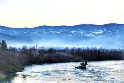 Scenic view of mountains against sky during winter