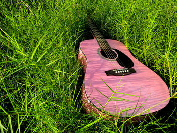 High angle view of guitar on field