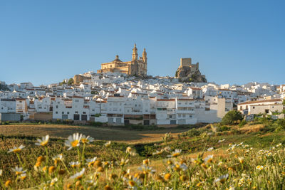 High angle view of townscape against clear blue sky