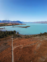 Scenic view of sea against clear blue sky