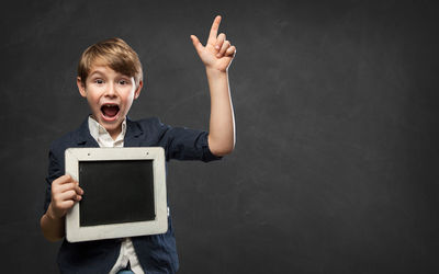 Portrait of man with arms outstretched